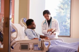 A hospitalist discusses a care plan with a patient