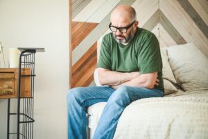 Person holding stomach suffering from indigestion